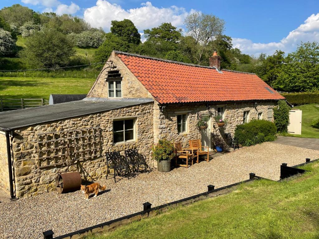 Picture of Mill Cottage with waterfall in North Yorkshire
