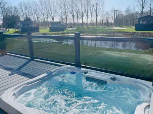 Four Seasons Lodge with Hot Tub Accommodation image 2 Four Seasons Lodge with Hot Tub image two