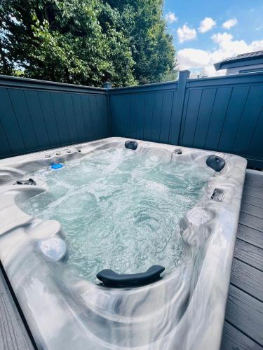 Fir Tree Lodge with Hot Tub Accommodation image 3 Fir Tree Lodge with Hot Tub image three