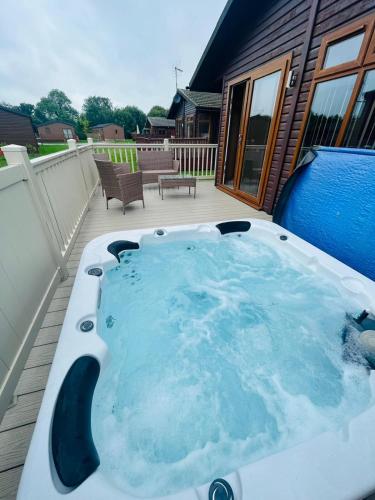Ness Lodge with Hot Tub Accommodation image 3 Ness Lodge with Hot Tub image three