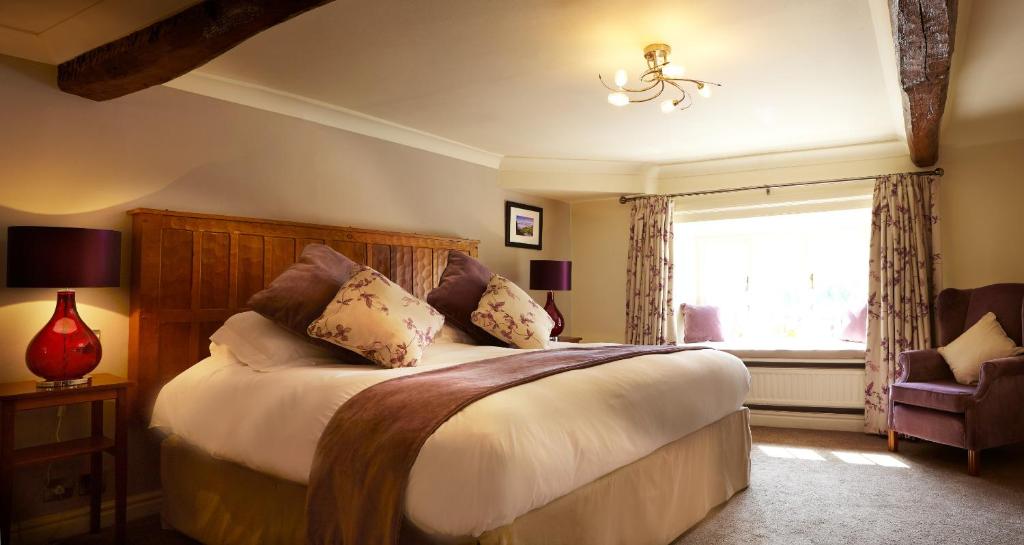 The Black Swan - The Inn Collection Group Accommodation image 4 Image name bed with beams helmsley black swan the 2 image from the post The Black Swan - The Inn Collection Group in Yorkshire.com.