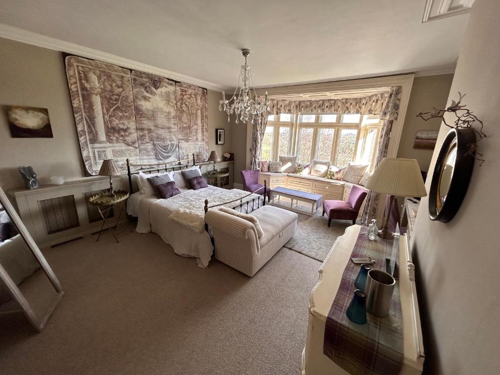 Hazel Manor Accommodation image 2 Image name bedroom with chandeliers hazel manor yorkshire the 2 image from the post Hazel Manor in Yorkshire.com.