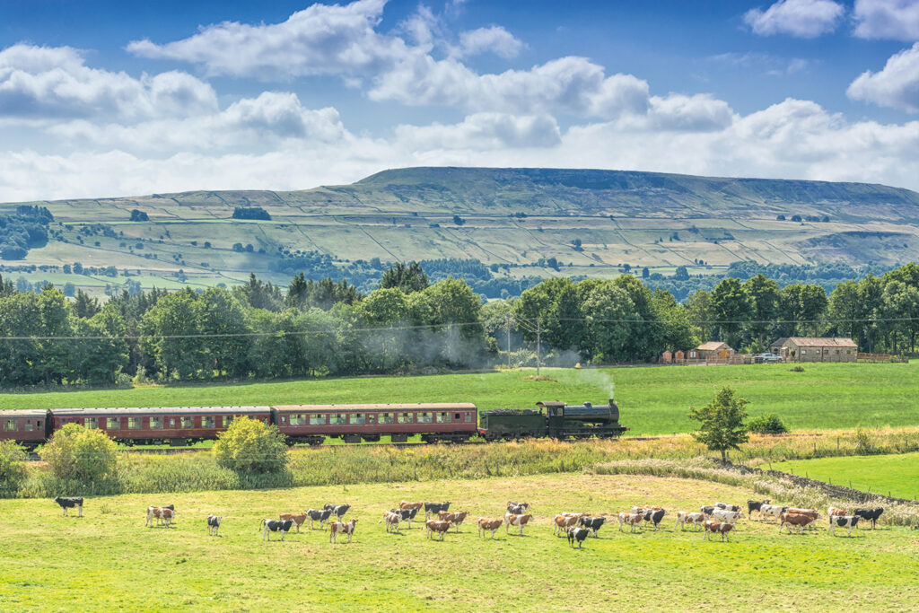 Generation Games Post image 4 Image name wensleydale railway in front of penhill the 4 image from the post Generation Games in Yorkshire.com.