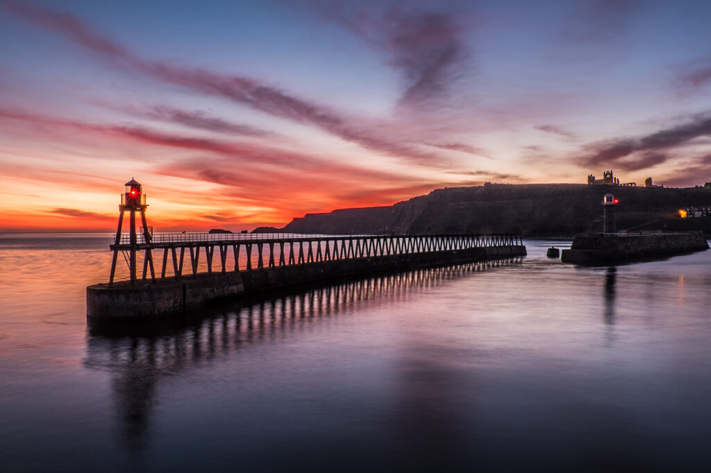 Best places to propose in Yorkshire on Valentine's Day Post image 2 Image name whitby pier sunset the 2 image from the post Best places to propose in Yorkshire on Valentine's Day in Yorkshire.com.