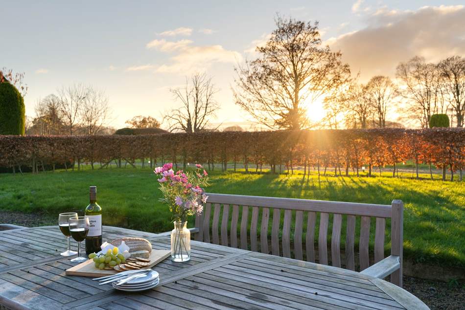 Image name classic cottages yorkshire holiday lets sunshine outside bottle of wine the 6 image from the post Classic Cottages launch in Yorkshire in Yorkshire.com.