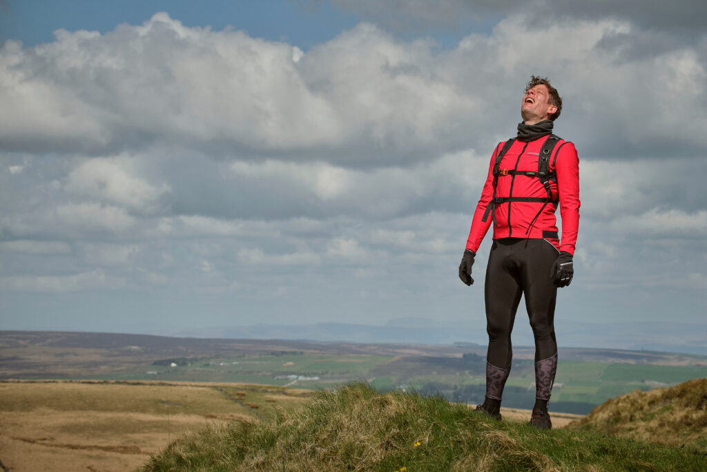 Where Happy Valley is filmed in Yorkshire - locations, venues and studios Post image 7 James Norton as Tommy Lee Royce in Happy Valley 3, cycling outfit above Warley Moor reservoir