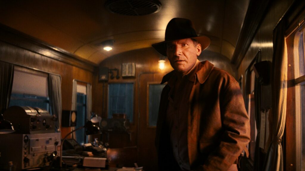 Visit the Yorkshire railway used in the new film: Indiana Jones and the Dial of Destiny Post image 3 Image name harrison ford indiana jones on train dial of destiny the 1 image from the post Visit the Yorkshire railway used in the new film: Indiana Jones and the Dial of Destiny in Yorkshire.com.