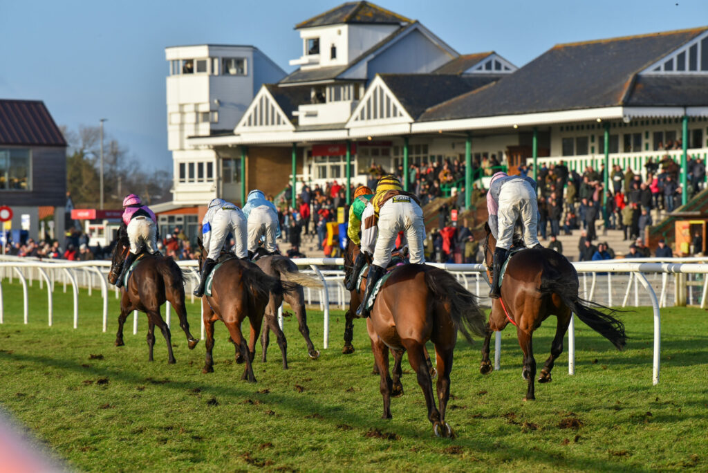Countryside Ladies' Day 2025: Racing, Fashion, and Fabulous Prizes Post image 1 Image name jockeys horses from behind catterick racecourse yorkshire the 1 image from the post Countryside Ladies' Day 2025: Racing, Fashion, and Fabulous Prizes in Yorkshire.com.