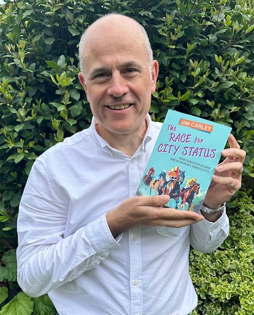 A New Book Chronicles How Doncaster Became One Of Britain’s Newest Cities Post image 1 Image name Jim Carley with Book the 1 image from the post A New Book Chronicles How Doncaster Became One Of Britain’s Newest Cities in Yorkshire.com.