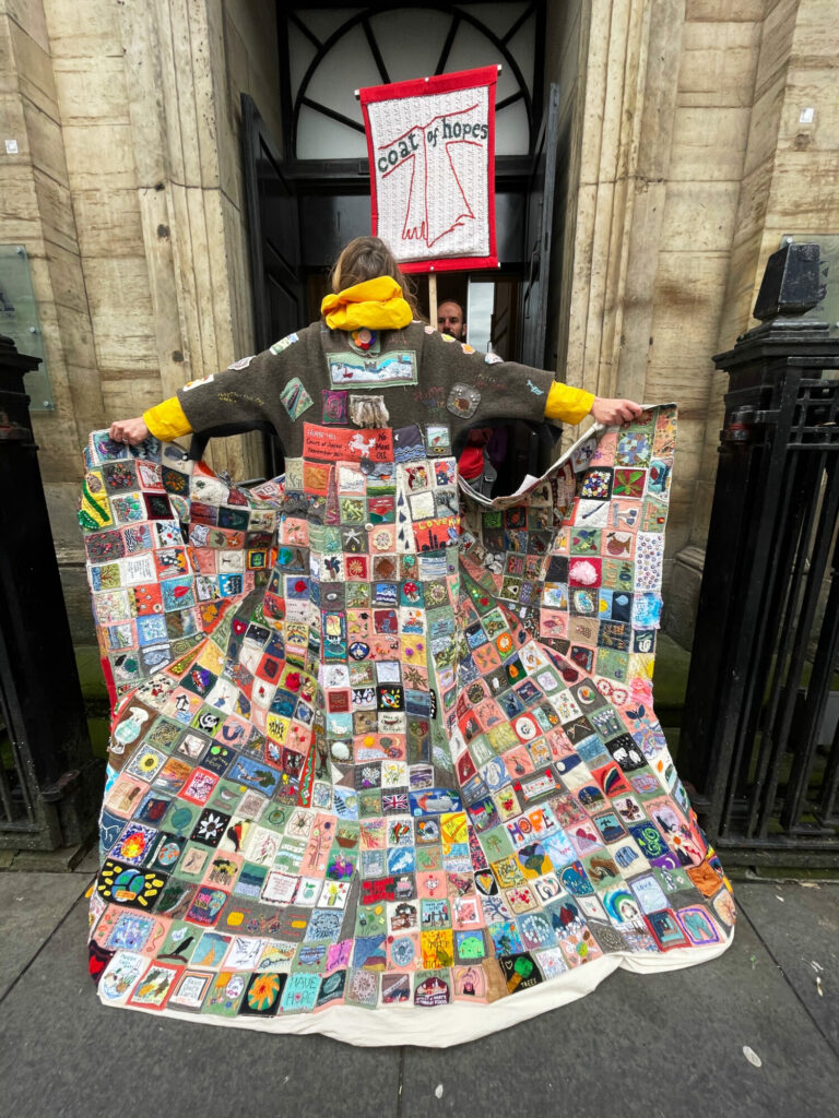 Coat of Hopes Hosted By Bradford Cathedral Post image 5 Image name Coat on steps 1 the 5 image from the post Coat of Hopes Hosted By Bradford Cathedral in Yorkshire.com.