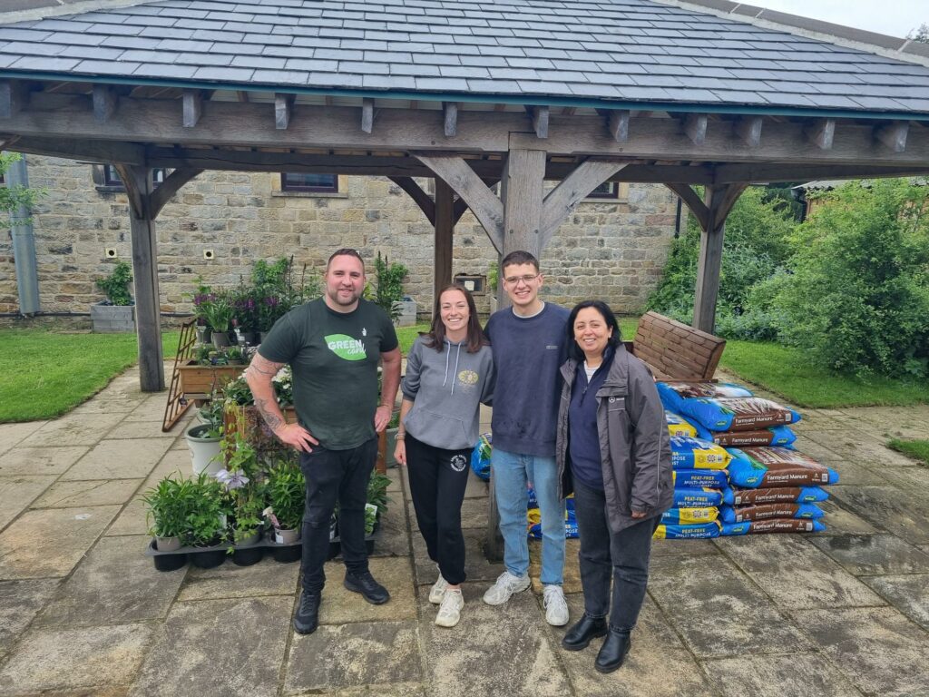 Image name 090724 Andy Bradley left and Aaron Cook second from right 1 the 1 image from the post Otley Garden Centre Revitalises Leeds Children's Charity Garden in Yorkshire.com.