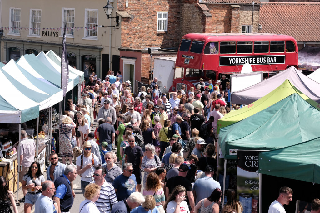 A Winter Trip to Malton – Food, Festivities and Charm Post image 1 Image name Crowds Market Place. Spring Malton Food Lovers Festival 2023. Photo credit Richard Ponter on behalf of Visit Malton the 1 image from the post A Winter Trip to Malton – Food, Festivities and Charm in Yorkshire.com.