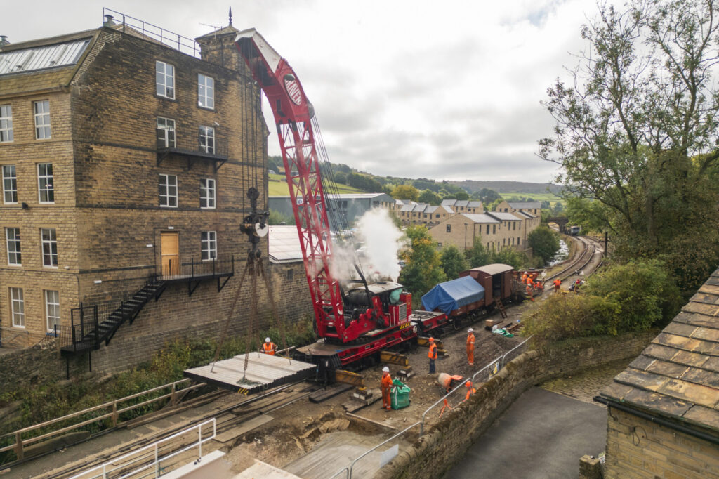 Keighley & Worth Valley Railway Completes £1.25 Million Bridge Replacement Project Post image 5 Image name KWVR Bridge 27 Bahamas Locomotive Society 50 Ton Steam Crane lifting a concete pad into postion the 5 image from the post Keighley & Worth Valley Railway Completes £1.25 Million Bridge Replacement Project in Yorkshire.com.