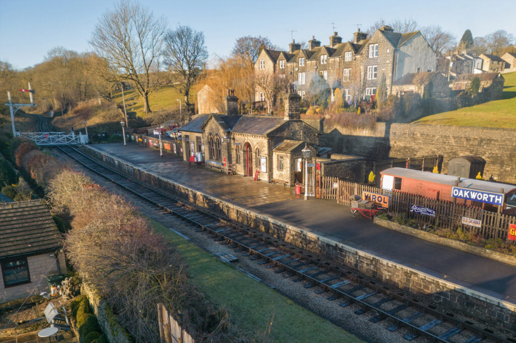 Behind the Scenes with the KWVR Grand Tour: Steam Engines and Classic Cinematic History Post image 6 Image name KWVR Oakworth Station the 6 image from the post Behind the Scenes with the KWVR Grand Tour: Steam Engines and Classic Cinematic History in Yorkshire.com.