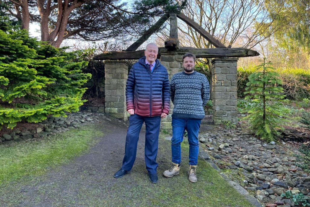 Historic Arbour at York Gate Garden Restored Just in Time for Snowdrop Days Post image 2 Image name Restored York Gate arbour Feb 2025 feat Cllr Billy Flynn and York Gate Garden Manager Jack Ogg the 2 image from the post Historic Arbour at York Gate Garden Restored Just in Time for Snowdrop Days in Yorkshire.com.