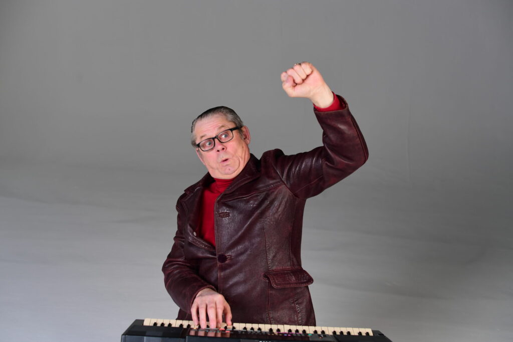 Who's Performing at Tramlines 2025? Russell Howard, Lucy Beaumont & More Join the Comedy Line-up Post image 1 Image name John Shuttleworth the 1 image from the post Who's Performing at Tramlines 2025? Russell Howard, Lucy Beaumont & More Join the Comedy Line-up in Yorkshire.com.