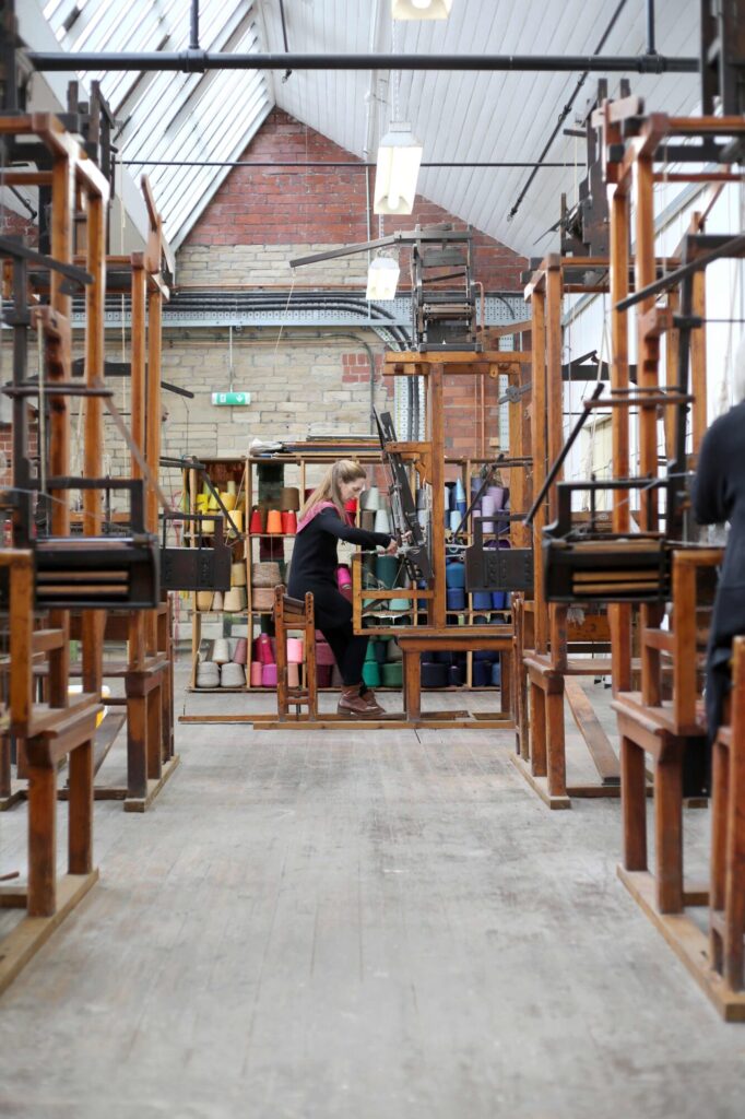 Image name Weaving on dobby looms Sunny Bank Mills supplied the 3 image from the post What’s Happening at Threads Textile Festival 2025 at Sunny Bank Mills? in Yorkshire.com.