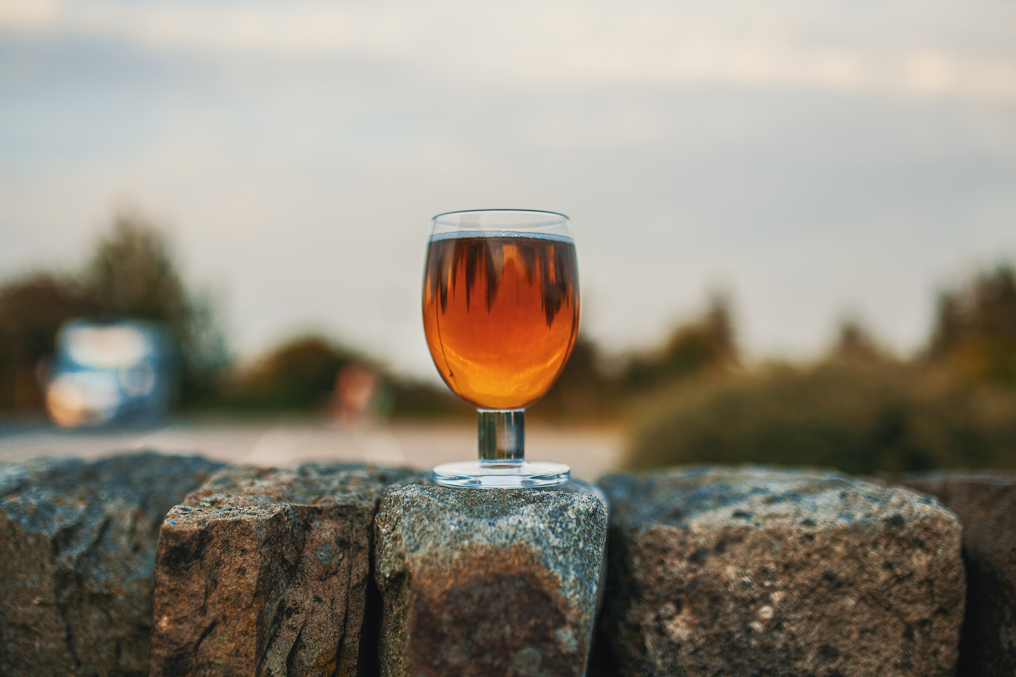 Image name beer on dry stone wall yorkshire the 8 image from the post Sleep, Sip & Stay: Yorkshire’s Best Drink Destinations with Nearby Stays in Yorkshire.com.
