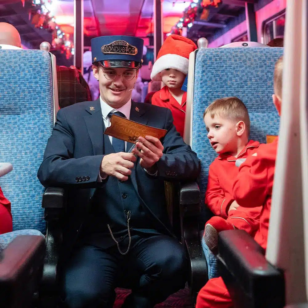 Image name Conductor with golden ticket the 23 image from the post All Aboard THE POLAR EXPRESS™ Train Ride at Wensleydale Railway in Yorkshire.com.