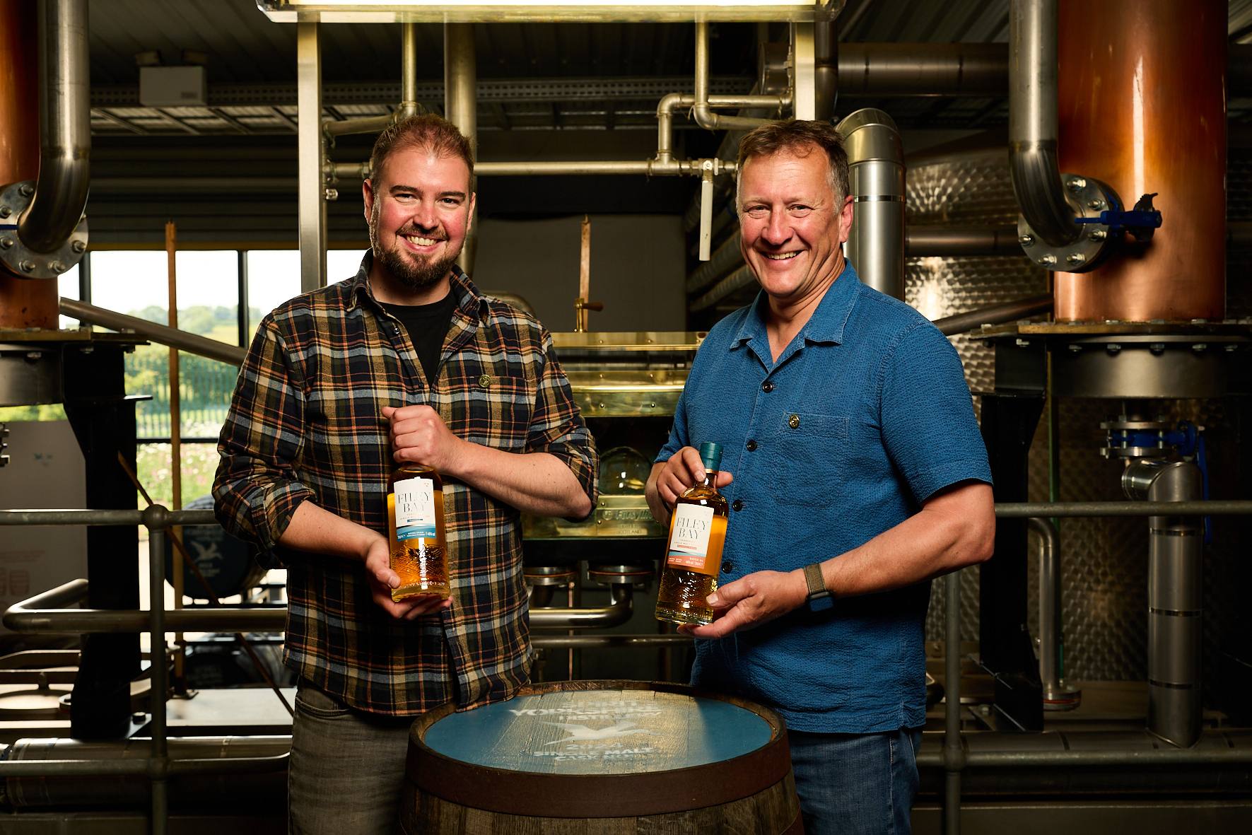 Image name Joe Clark and David Thompson with two of the IWSC award winning whiskies the 2 image from the post Yorkshire’s First Whisky Distillery Strikes Gold on the World Stage in Yorkshire.com.
