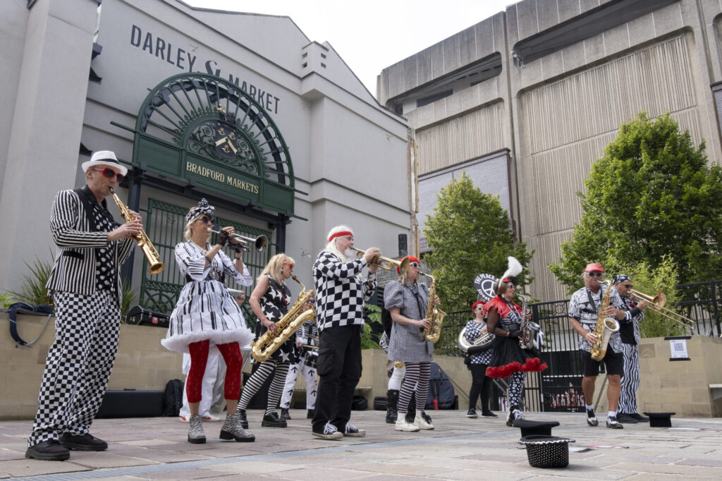 Honk! Bradford: A Rhythmic Countdown Begins Post image 1 Image name darley street market peace artistes 1 the 1 image from the post Honk! Bradford: A Rhythmic Countdown Begins in Yorkshire.com.