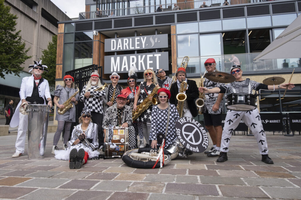 Honk! Bradford: A Rhythmic Countdown Begins Post image 2 Image name darley street market peace artistes 2 the 2 image from the post Honk! Bradford: A Rhythmic Countdown Begins in Yorkshire.com.