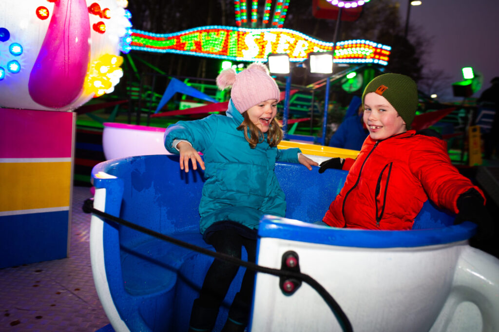 Image name Children enjoying the funfair at Yorkshires Winter Wonderland the 2 image from the post What's On At Yorkshire Winter Wonderland At McArthurGlen Designer Outlet York This Year? in Yorkshire.com.