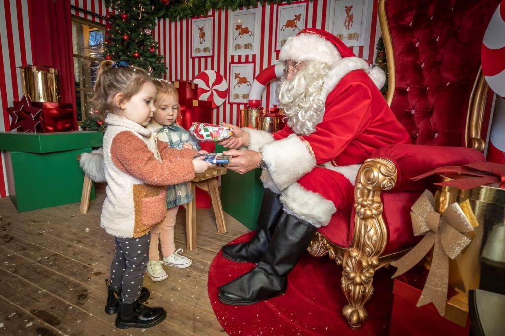 Image name Santa and children at Yorkshires Winter Wonderland resized the 5 image from the post What's On At Yorkshire Winter Wonderland At McArthurGlen Designer Outlet York This Year? in Yorkshire.com.