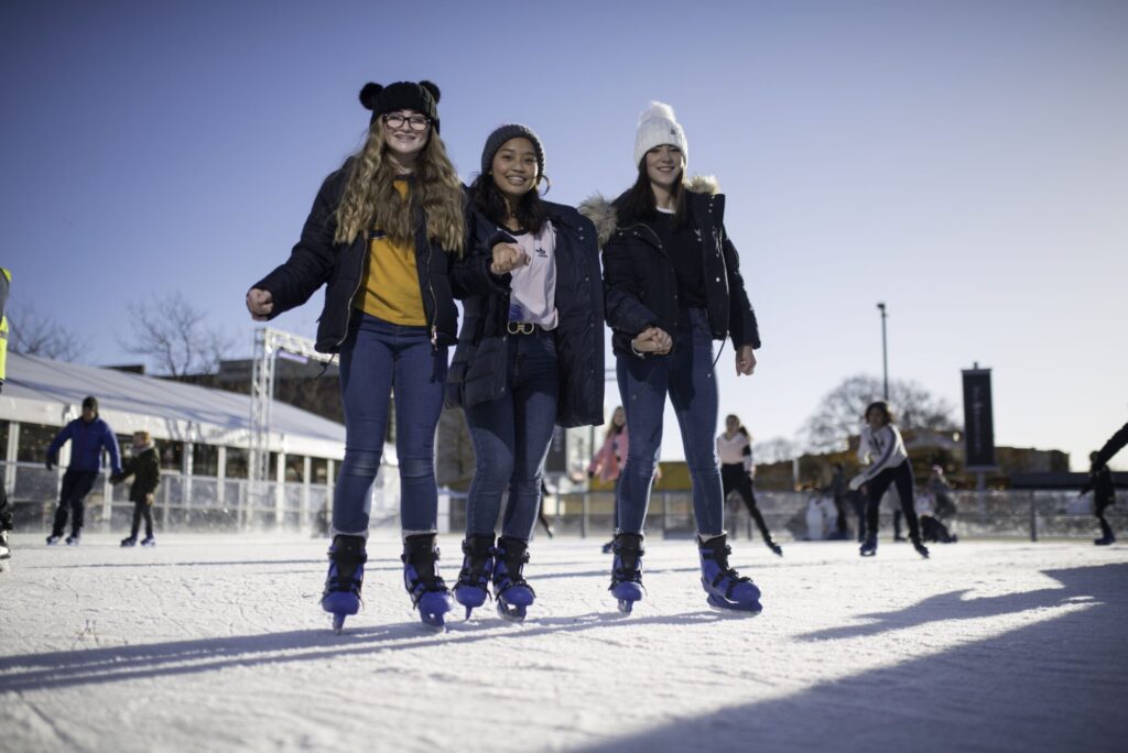 Image name Three girls skating at Yorkshires Winter Wonderland the 11 image from the post What's On At Yorkshire Winter Wonderland At McArthurGlen Designer Outlet York This Year? in Yorkshire.com.