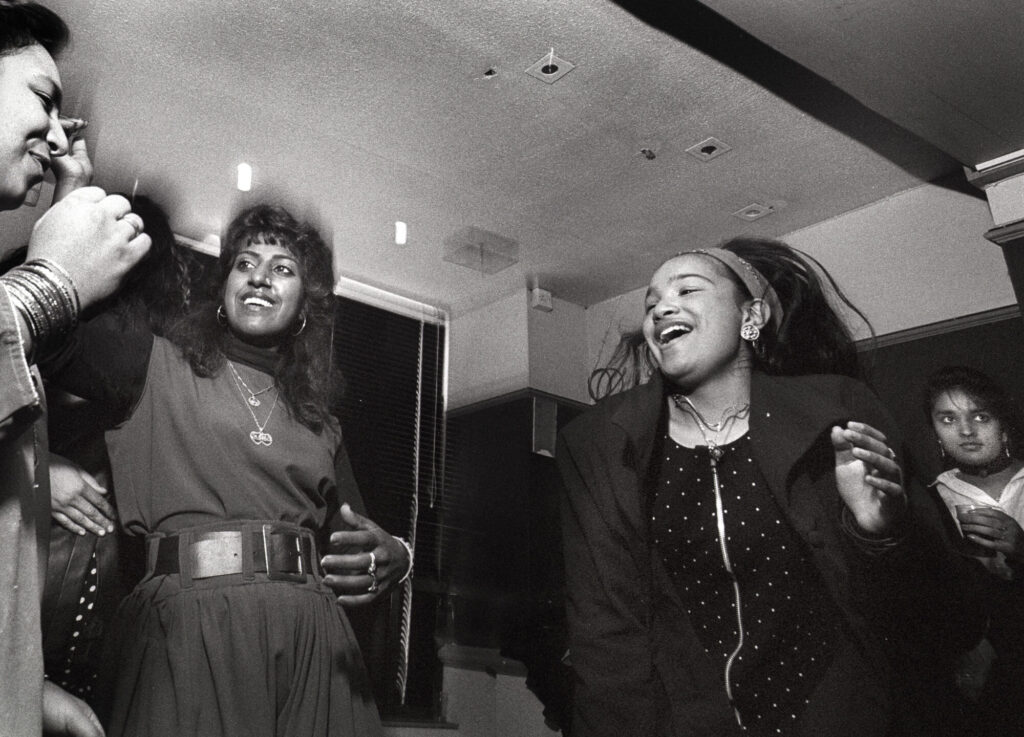 Image name 26406 Dancing at a daytimer in a small club under the Alhambra Theatre in Bradford. Circa 1990 Photo by Tim Smith Daytimer 1725 2 19 Tim Smith 1 the 4 image from the post Bradford 2025: What Were The Secret Daytimer Parties For South Asian Youth In The 1980s? in Yorkshire.com.