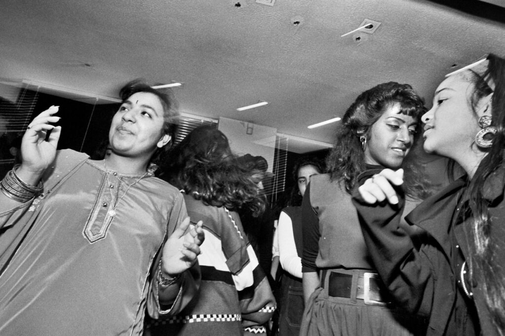 Image name 26407 Dancing at a daytimer in Bradford circa 1990. Photo by Tim Smith Daytimer 1725 2 32 Tim Smith 1 the 5 image from the post Bradford 2025: What Were The Secret Daytimer Parties For South Asian Youth In The 1980s? in Yorkshire.com.