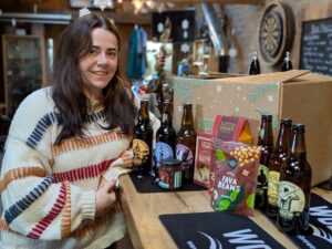 Image name 081225 Hannah Hatfield with the Christmas Beer and Snacks Gift Box the 1 image from the post Brighouse in Yorkshire.com.